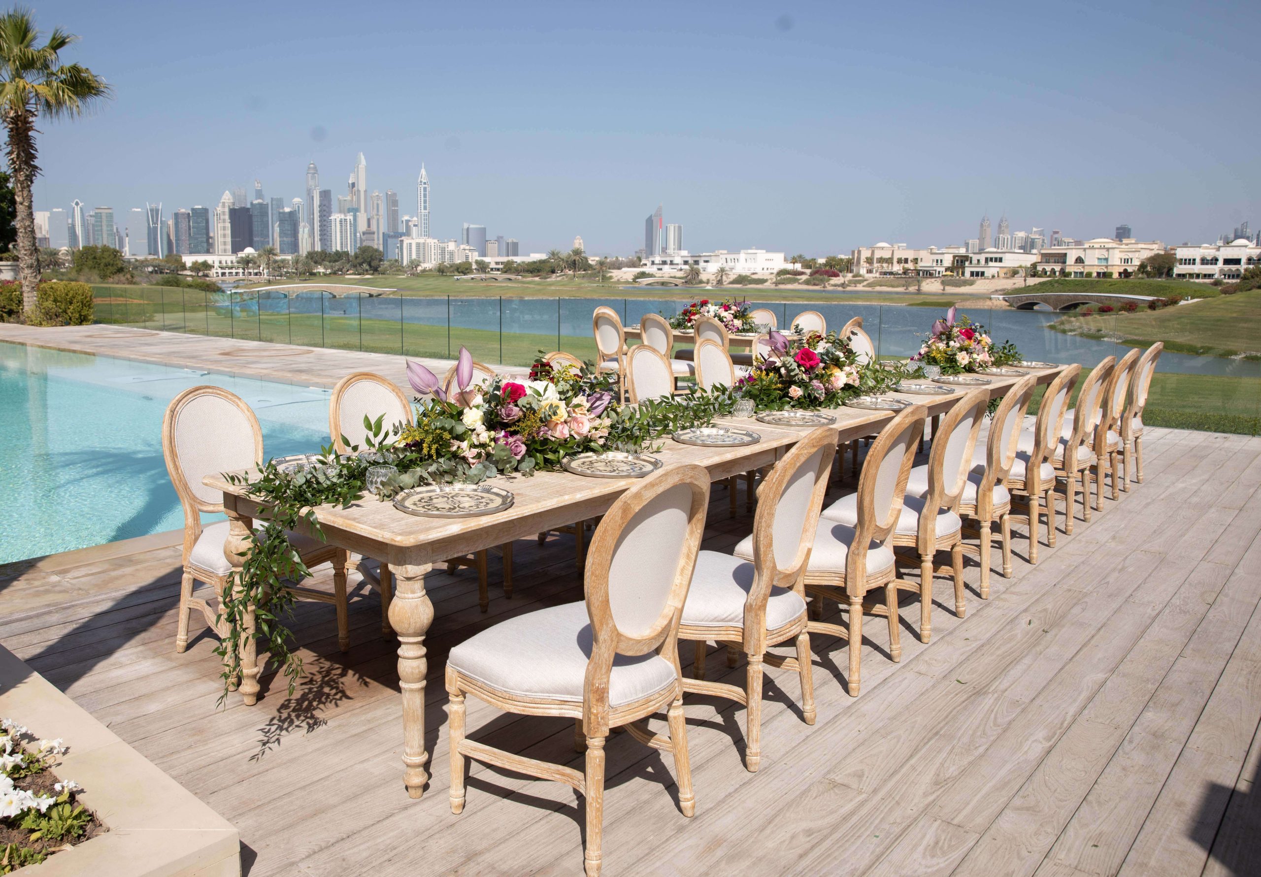 A stunning wedding lunch set up in Dubai with beautiful floral arrangements.