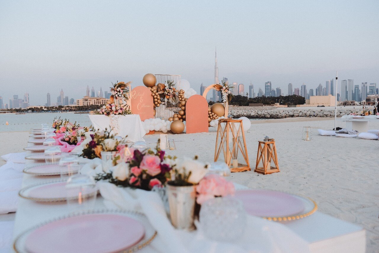 A Stunning beach wedding set up in Dubai with the view of Burj Khalifa.